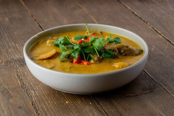 Closeup shot of a yellow cream soup