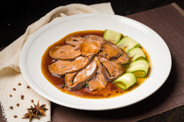 Special Chinese food braised pork heart on retro background