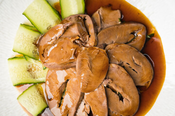 Special Chinese food braised pork heart on retro background