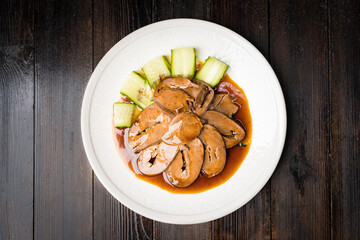 Special Chinese food braised pork heart on retro background