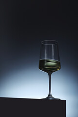 White wine in a transparent glass in low key