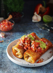 A typical dish of Mexican cuisine - Chimichanga, made of tortilla with different ingredients