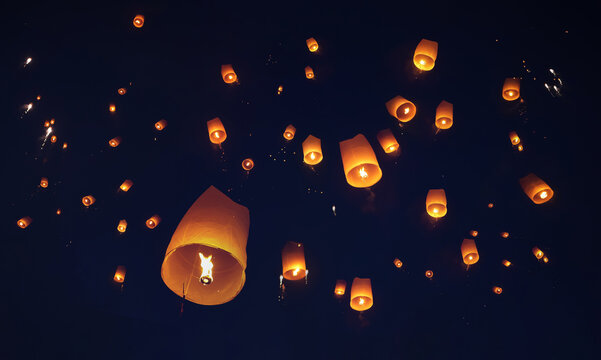 Release the traditional paper lanterns into the sky during the night of the festival in Thailand.