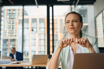 Businesswoman is angry during working day in office