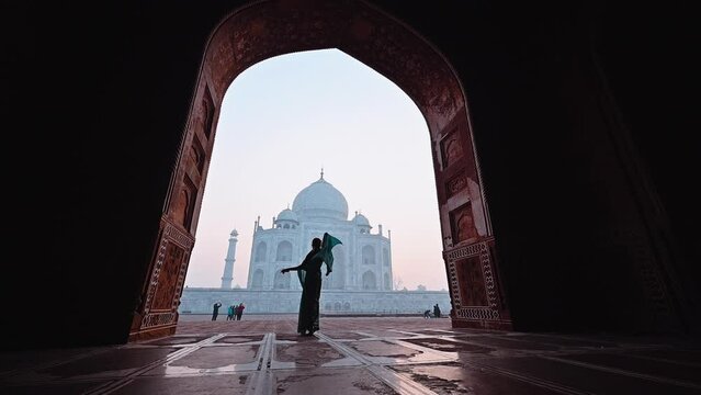 Slow motion footage of a female in Saree dress dancing in Taj Mahal Indi