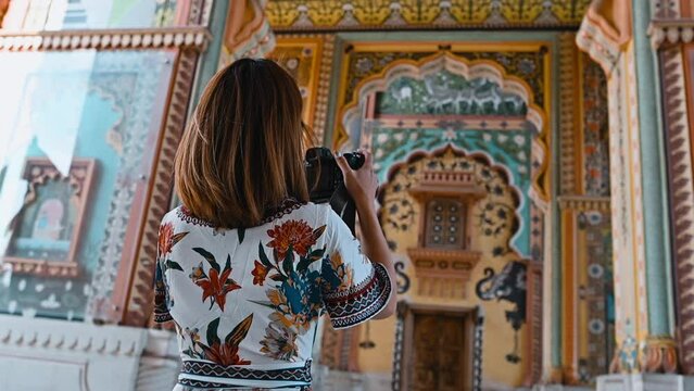 Slow-motion footage of Asian female traveling at the Patrika gate The ninth gate of Jaipur India