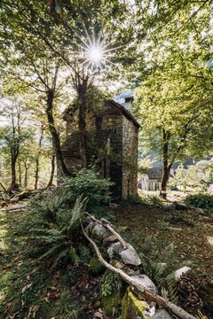 Vertical shot of a sunny day in Cevio, Foroglio, Switzerland
