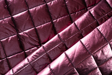 wine-colored surface of jacket fabric with padding polyester folded