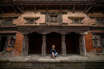 Female tourist at Patan Royal Palace Complex in Lalitpur, Nepal