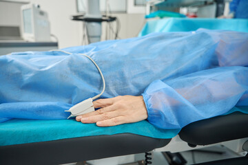 Close up photo of patient with pulse measurement on arm
