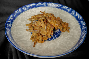 Crispy seasoned fried anchovies. Indonesian food.