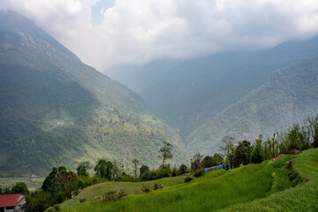Fototapeta premium Green mountain landscape with a cloudy sky