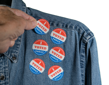 Blue denim working clothing with many Voted stickers on white background