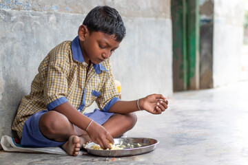 Student having mid day meal at school