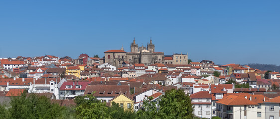 Panoramic main view at the downtown Viseu city, with iconic building at the Cathedral of Viseu on top, Se Cathedral de Viseu, and portuguese typical old center city - obrazy, fototapety, plakaty