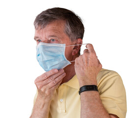 Senior man adjusting face mask and looking very worried about the epidemic - Powered by Adobe