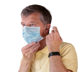 Senior man adjusting face mask and looking very worried about the epidemic