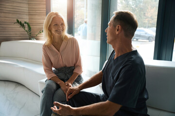 Adult male talking to happy beautiful woman