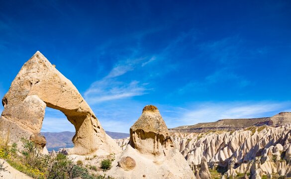 Amazing rocks in Cappadocia near Goreme eroded into spectacular pillars and minaret-like forms. Cappadocia is very popular tourist destination in Turkey.