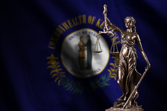 Kentucky US state flag with statue of lady justice and judicial scales in dark room. Concept of judgement and punishment