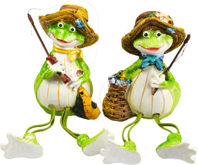 Two cute ceramic frogs in hat isolated on white background