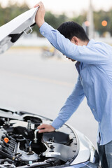 Man with checking car engine.