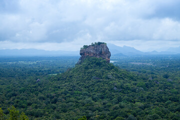 Fototapeta na wymiar Sigiriya is an ancient rock fortress located in Sri Lanka. It is a site of historical and archaeological significance that is dominated by a massive column of rock approximately 180m high.