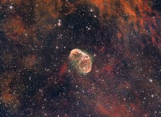 Dramatic scenery of a starry and vibrant galaxy with colorful clouds in the sky at night