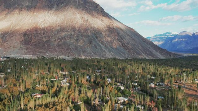 aerial view of Hunder village in Himalayas in the morning, background in Nubra Valley, Ladakh, India.
