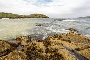 Rocky lake coast on a gloomy day