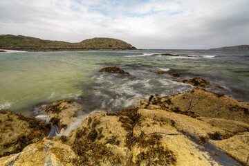 Rocky lake coast on a gloomy day