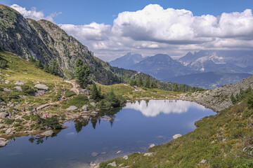 Naklejka na ściany i meble View of Spiegelsee [Mirror lake] as seen on the trial from Rippetegg summit back to Rieteralm, Schladming, Styria, Austria
