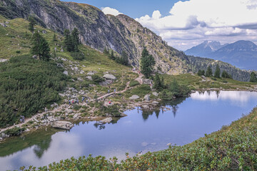 View of Spiegelsee [Mirror lake] as seen on the trial from Rippetegg summit back to Rieteralm, Schladming, Styria, Austria