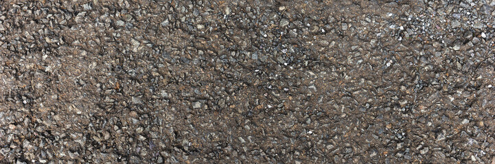 Panoramic image. Rough asphalt road. Top view