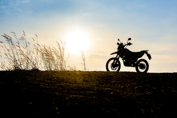 Motocross on a beautiful light mountain independent adventure tourism concept