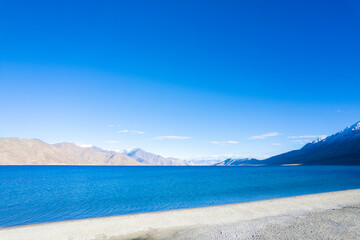 Fototapeta na wymiar Aerial landscape of Pangong Lake and mountains with clear blue sky, it's a highest saline water lake in Himalayas range, landmarks and popular for tourist attractions in Leh, Ladakh, India, Asia 
