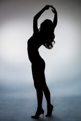 dancing silhouette of slim girl