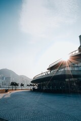 Vertical shot of modern buildings and a paved road in Hong Kong