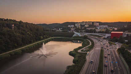 Obraz premium Drone view of the Niedźwiednik district, the PKM viaduct and the water reservoir at sunset.