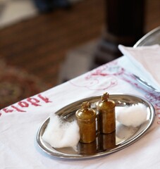 And metal Tableware for Baptism on table with white sheet