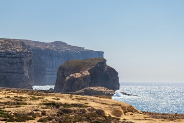Fototapeta na wymiar Scenic shot of the Fungus Rock at Dwejra in Gozo Malta with a clear sky in the background