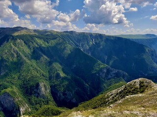 Beautiful landscape of big mountains covered in tropical forests on a sunny day