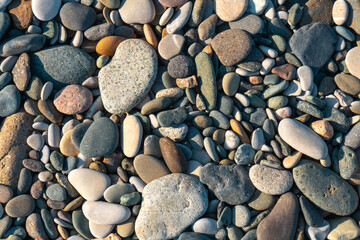 Close up of rounded and polished beach rocks