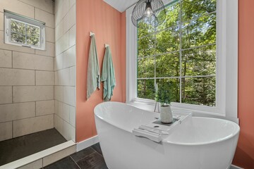 Beautiful interior design of a pink bathroom in a modern custom new England colonial home