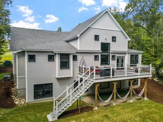 Beautiful exterior of a modern custom new England colonial home with a garden
