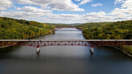 Drone shot of Taconic State Parkway over the New Croton Reservoir between greenery landscapes © Audley C Bullock/Wirestock Creators