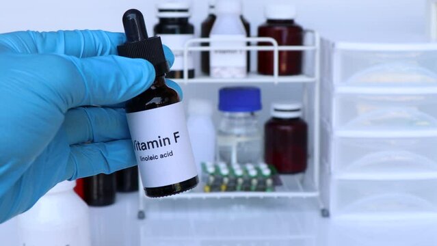 Vitamin F pills in a bottle, food supplement for health or used to treat disease
