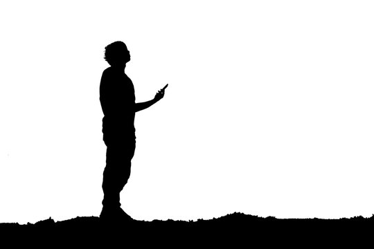 silhouette of a person with a moblie