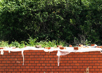underconstruction brick wall of the house or fence