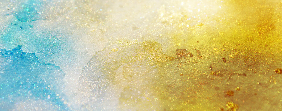 Vorlage eines glitzernden Hintergrunds in Gold und T&uuml;rkis mit abstrakten Bokeh-Lichtern